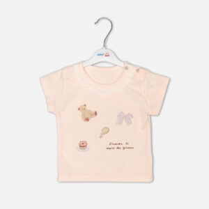 Baby girls peach short-sleeve t-shirt with eyelet lace collar and teddy bear print paired with pink ruffled shorts from Mini & Me.
