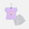 Baby girl summer outfit featuring a purple "Little Sister" t-shirt with a textured 3D rainbow and ruffle sleeves paired with grey shorts with lace detailing from Mini & Me.