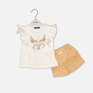 Baby girl summer outfit featuring a white ruffle-sleeve top with floral embroidery and matching tan embroidered shorts from Mini & Me.