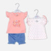 Baby girl 3-piece summer clothing set featuring a peach top with "Flower" graphic, a white and pink polka dot top, and blue ruffle shorts from Mini & Me.