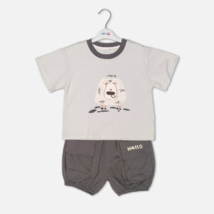 Toddler boy 2-piece summer clothing set featuring a cream t-shirt with a cartoon sheep graphic and a charcoal grey crewneck collar paired with matching grey harem-style cargo shorts with "Hello" pockets from Mini & Me.