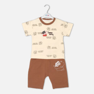 Toddler boy 2-piece summer clothing set featuring a cream t-shirt with an all-over Crayon Shin-chan character graphic print paired with matching brown shorts from Mini & Me.