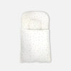 Premium white cotton baby carry nest with minimalist scattered print and built-in head support pillow from Mini & Me, as shown in CarryNest3.jpg.