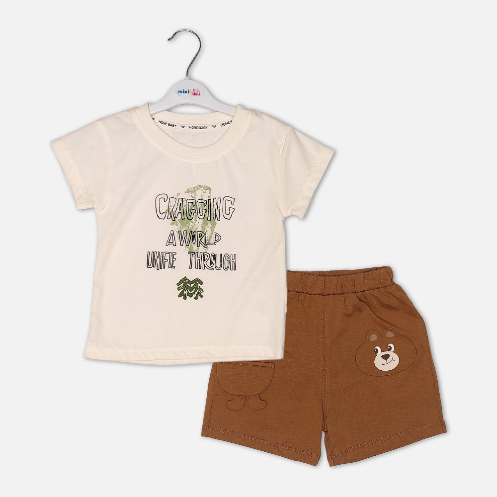 boysSuit14161-1-1 Toddler boy 2-piece summer clothing set featuring a cream t-shirt with a green "Cragging" graphic print, paired with matching brown elasticated shorts detailed with a cartoon bear face pocket from Mini & Me.