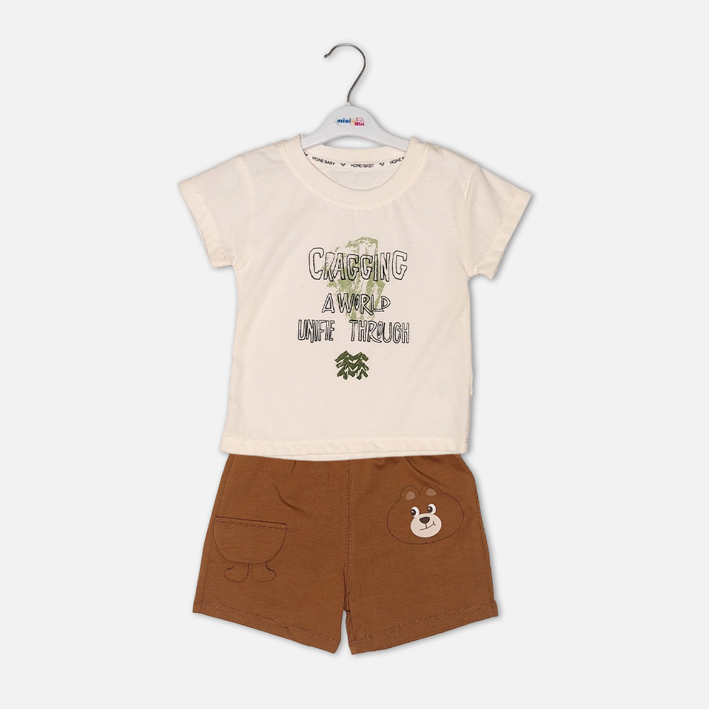 boysSuit14161-1-2 Toddler boy 2-piece summer clothing set featuring a cream t-shirt with a green "Cragging" graphic print, paired with matching brown elasticated shorts detailed with a cartoon bear face pocket from Mini & Me.