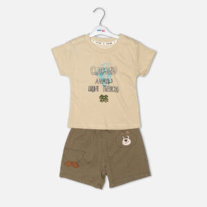 Toddler boy 2-piece summer clothing set featuring a khaki-beige t-shirt with a "Cragging" graphic print, paired with matching olive-brown elasticated shorts detailed with a cartoon bear face pocket from Mini & Me.