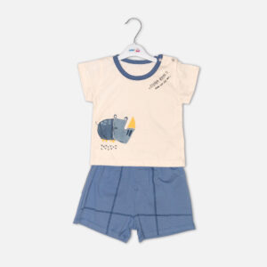 Toddler boy 2-piece summer clothing set featuring a cream t-shirt with a blue cartoon rhinoceros graphic and blue neckline trim, paired with matching blue elasticated shorts from Mini & Me.