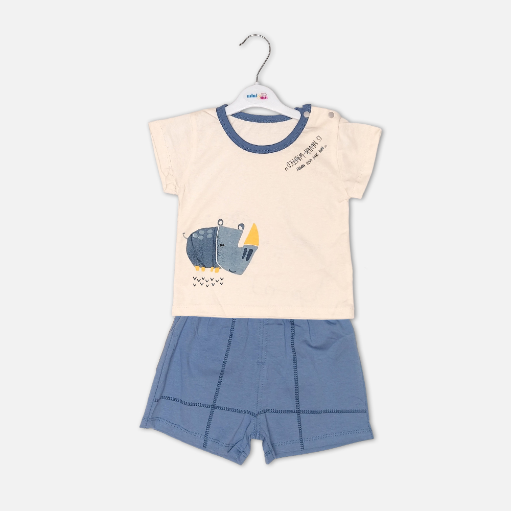 boysSuit14162-1-2 Toddler boy 2-piece summer clothing set featuring a cream t-shirt with a blue cartoon rhinoceros graphic and blue neckline trim, paired with matching blue elasticated shorts from Mini & Me.
