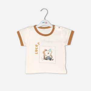 Toddler boy 2-piece summer clothing set featuring an off-white t-shirt with a "Lucky" cartoon toast graphic and tan trim details, paired with matching tan elasticated shorts from Mini & Me.