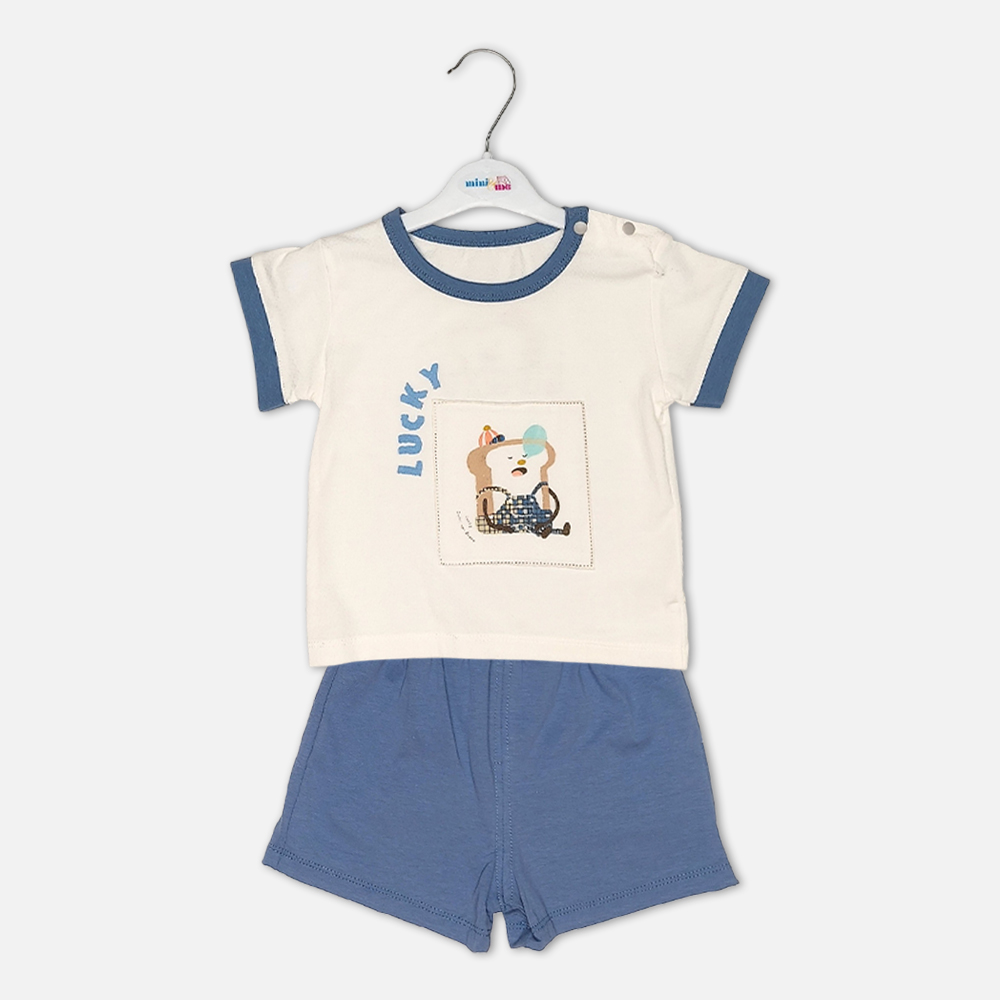 boysSuit14172-2-2 Toddler boy 2-piece summer clothing set featuring a cream t-shirt with a blue cartoon rhinoceros graphic and blue neckline trim, paired with matching blue elasticated shorts from Mini & Me.