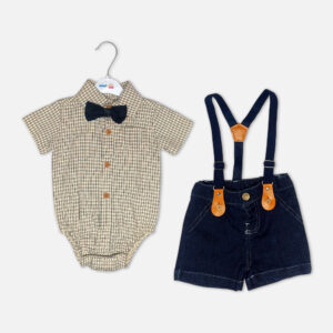 Checkered baby bodysuit with black bow tie next to denim suspender shorts with tan leather details on a white background.