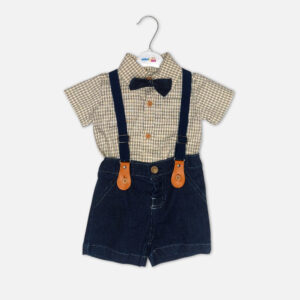 Checkered baby bodysuit with black bow tie next to denim suspender shorts with tan leather details on a white background.