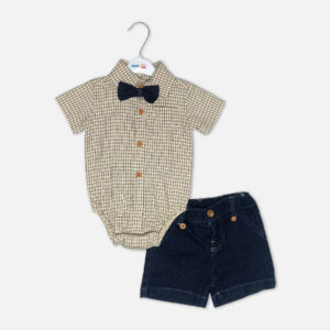 Checkered baby bodysuit with black bow tie next to denim suspender shorts with tan leather details on a white background.