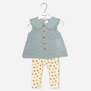 Baby girl 2-piece summer clothing set displaying a sleeveless sage green button-down frock with a ruffled Peter Pan collar and textured fabric, paired with cream-colored ankle leggings featuring an all-over ditsy floral print from Mini & Me.