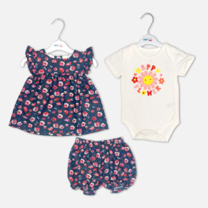 Baby girl 3-piece summer clothing set showcasing a sleeveless navy blue frock with a red and pink floral print and ruffled shoulders, displayed alongside a white short-sleeve bodysuit with a "Happy Flower" graphic print and matching navy floral bloomer shorts from Mini & Me.