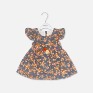 An elegant dark grey baby girl cotton frock with a vibrant orange and peach vintage floral print, featuring ruffle cap sleeves and a thin pink waist ribbon detailed with a central three-piece fabric flower cluster.