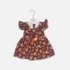 Infant girl deep purple floral print frock with ruffle sleeves and waist flower embellishment hanging on a white hanger.