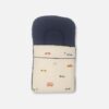 Premium cotton baby carry nest from Mini & Me featuring a solid navy blue top headrest pillow and a cream-colored lower blanket printed with small colorful vintage cars, buses, and bicycles.