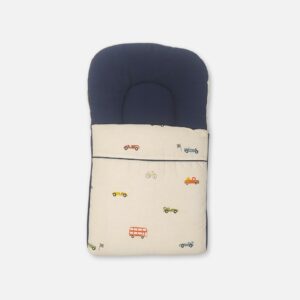 Premium cotton baby carry nest from Mini & Me featuring a solid navy blue top headrest pillow and a cream-colored lower blanket printed with small colorful vintage cars, buses, and bicycles.