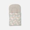 Premium cotton baby carry nest from Mini & Me featuring a soft grey and white polka dot headrest with an attached lower blanket decorated with white and mint blue clouds, tiny stars, and crescent moons.
