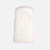 Premium cotton baby carry nest from Mini & Me in an off-white cream color, detailed with a subtle scattered print of tiny pink flowers and minimalist leaves across both the headrest pillow and the lower swaddle blanket layer.