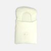 Premium cotton baby carry nest from Mini & Me in a solid pastel mint green color, detailed with an integrated head support pillow and a small, delicate embroidered text graphic reading Little Dreamer across the lower front layer.