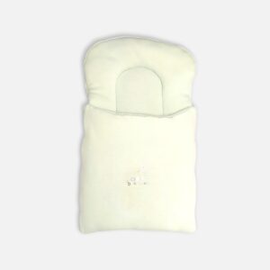 Premium cotton baby carry nest from Mini & Me in a solid pastel mint green color, detailed with an integrated head support pillow and a small, delicate embroidered text graphic reading Little Dreamer across the lower front layer.