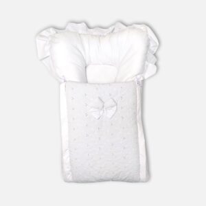 Premium white baby carry nest and sleeping bag featuring delicate floral eyelet embroidery, a fabric bow, ruffle-trimmed hood, and a matching separate head pillow.