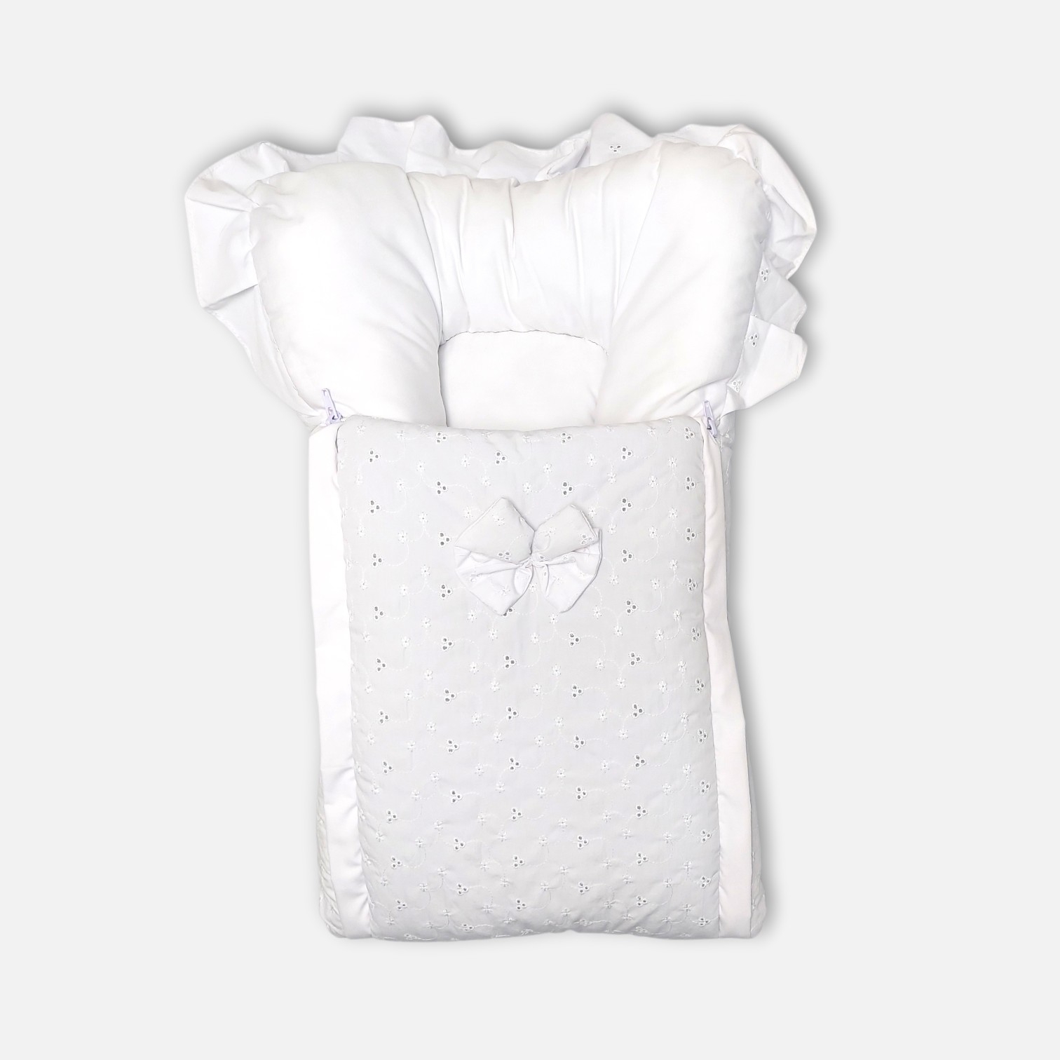 20260713_183419 (14) Premium white baby carry nest and sleeping bag featuring delicate floral eyelet embroidery, a fabric bow, ruffle-trimmed hood, and a matching separate head pillow.