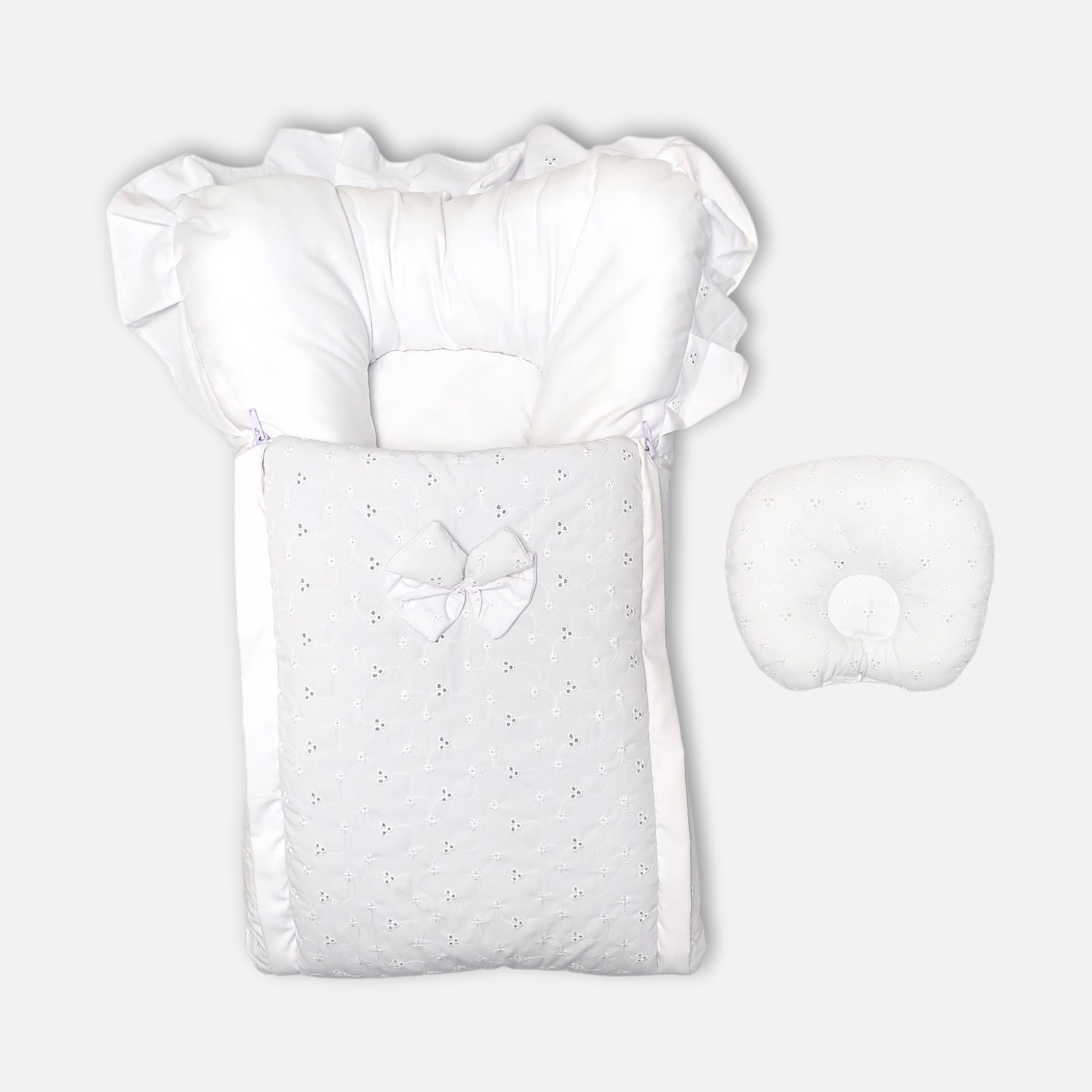 20260713_183419 (15) Premium white baby carry nest and sleeping bag featuring delicate floral eyelet embroidery, a fabric bow, ruffle-trimmed hood, and a matching separate head pillow.