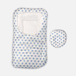 White baby swaddle wrap and sleeping pod featuring an all-over blue heart print pattern, a cushioned headrest section, and an adjustable wrap-around flap.