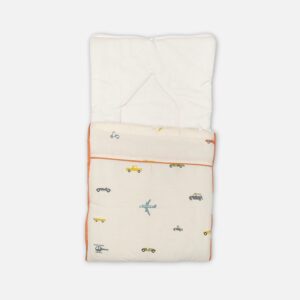 A premium convertible cream-colored baby carry nest with a terracotta trim and backing, featuring a minimalist scattered print of blue airplanes, grey helicopters, and small cars across the lower blanket section.