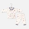 Unisex white cotton baby nightwear set from Mini and Me featuring a long-sleeve button-down shirt and matching pants with a London transport theme print including double-decker buses and cars.