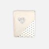 A folded off-white and grey 100% cotton hooded baby blanket featuring an embroidered swan design on the solid corner hood and a repeating small grey star print on the main fabric section.