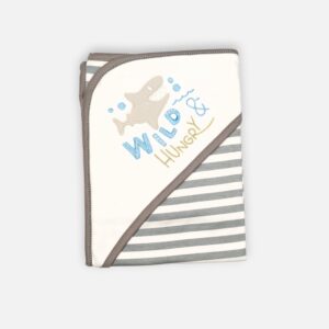 A folded grey and white 100% cotton hooded baby blanket featuring an embroidered shark graphic with the text "Wild & Hungry" on the solid white corner hood and a repeating horizontal grey and white striped pattern on the main fabric body.