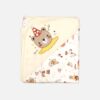 A folded cream and off-white hooded baby blanket featuring a repeating vintage circus and carnival print on the body, with a solid cream hood detailed with an embroidered bear head wearing a red party hat.