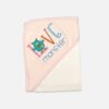 A folded light pink and cream hooded baby blanket featuring a colorful embroidered text that reads Love Monster with a cute green monster character graphic.
