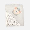 A folded light grey and off-white hooded baby blanket featuring a repeating panda face and star pattern on the body, with a solid grey hood detailed with an embroidered bear head wearing a hat and the text "BE HAPPY."