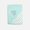 A folded turquoise and white 100% cotton hooded baby blanket featuring an embroidered swan design on the solid corner hood and a repeating small turquoise star print on the main fabric section.
