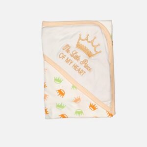 A folded white 100% cotton hooded baby blanket featuring an embroidered gold crown graphic with the text "The Little Prince OF MY HEART" on the corner hood, combined with a repeating small green and orange crown print pattern on the main body.