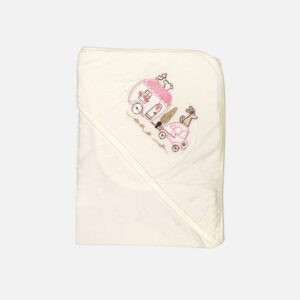 A folded off-white 100% cotton hooded baby blanket featuring an embroidered pink caravan, a small pink car with a dog, and a tree on the corner hood section, displayed over a clean background.