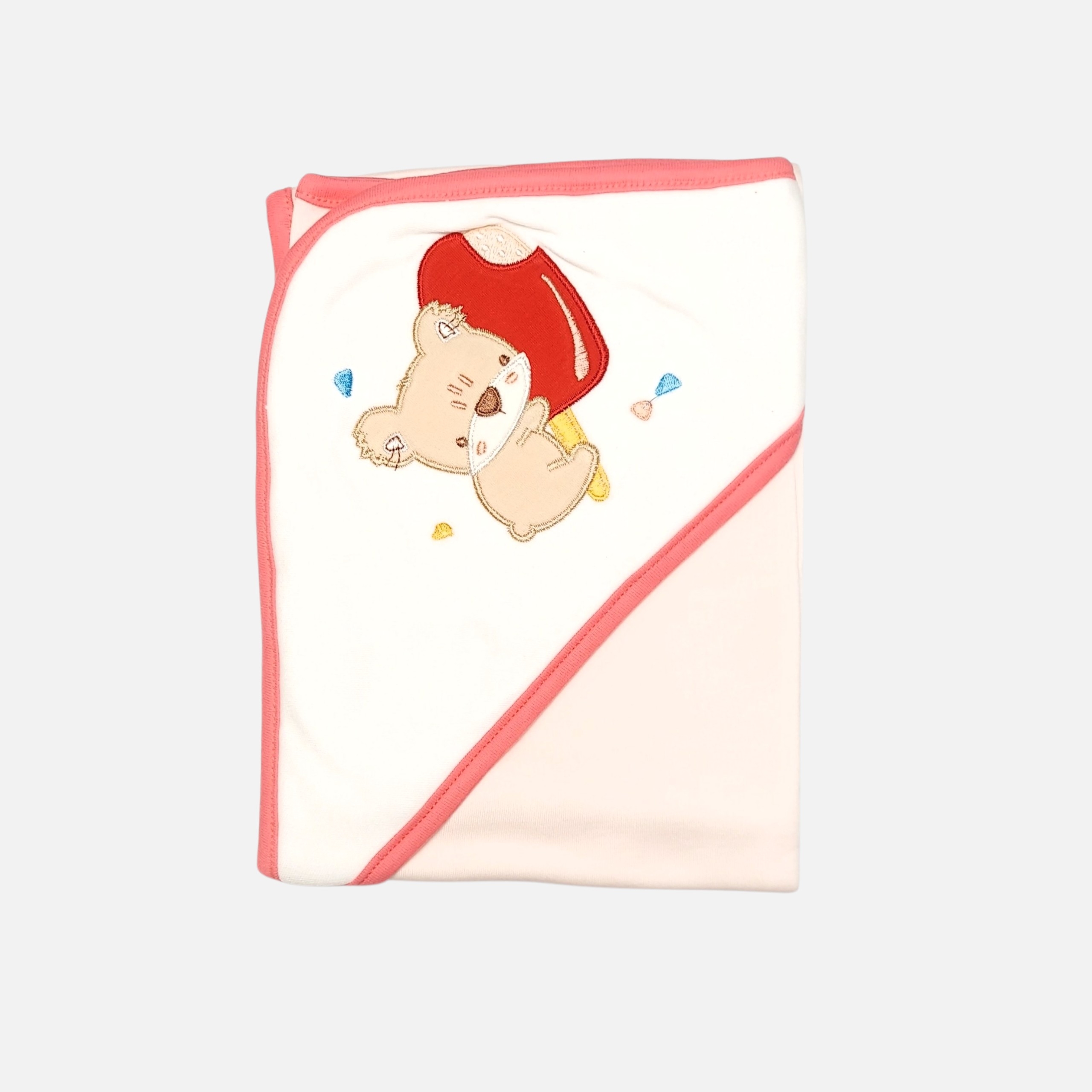 20260720_180530 (8) (7) A folded coral pink and white 100% cotton hooded baby blanket featuring an embroidered cartoon bear holding a red ice cream popsicle on the solid white corner hood section, displayed over a clean background.