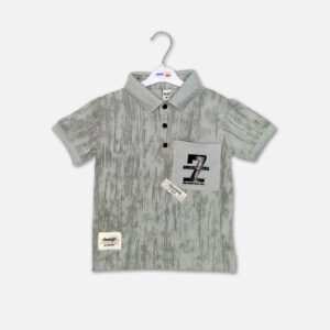 Alt Text Light olive-gray textured short-sleeve polo shirt for toddler boys featuring a black three-button collar, a front chest pocket with a graphic design, and casual stitched patches, displayed on a hanger.