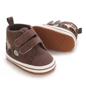 Pair of brown corduroy and faux leather high-top baby sneakers featuring dual hook-and-loop straps, embroidered tractor and snail illustrations on the side, a white sole border, and a textured non-slip dotted brown outsole.