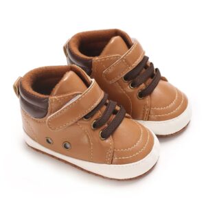 Pair of tan faux leather high-top baby sneakers with dark brown padded ankle collars, brown elastic laces, a single hook-and-loop strap, metal side eyelets, and a white sole border.