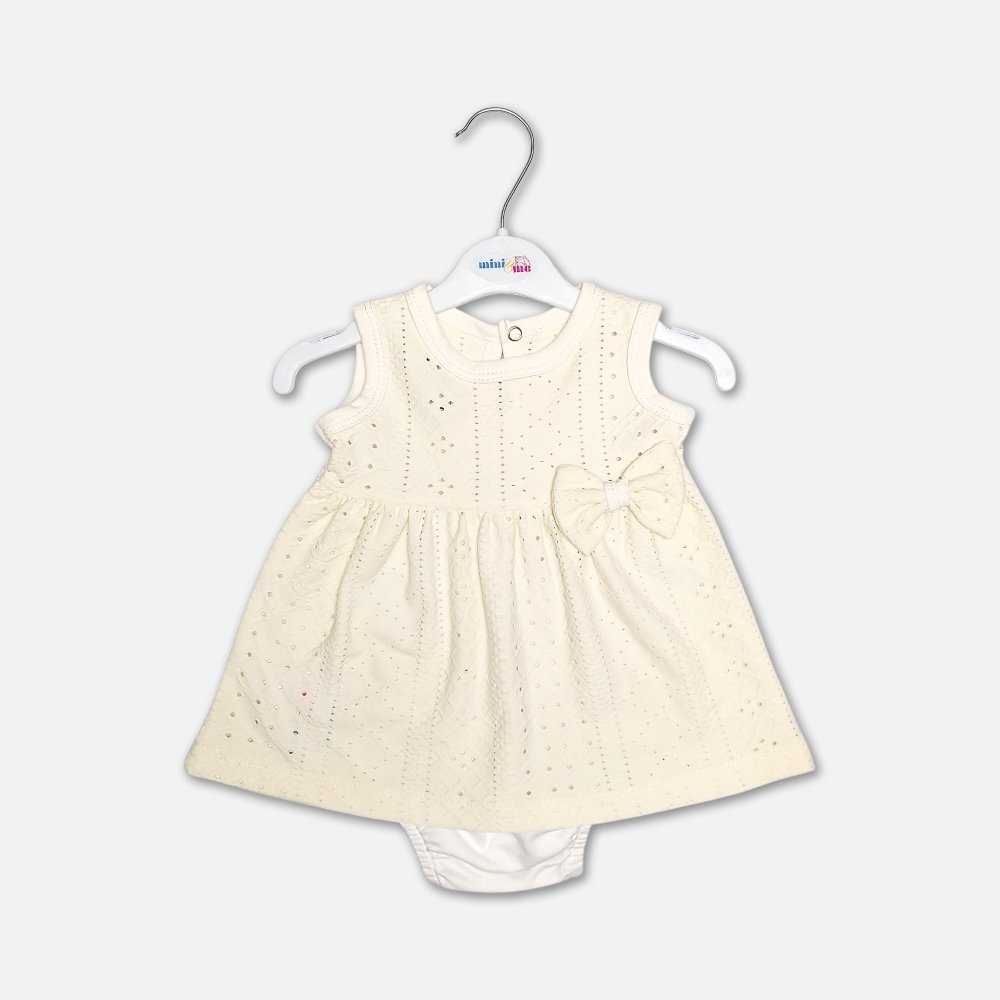 girlsFrock16109-2 A premium three-piece baby girls cream summer clothing set featuring a sleeveless eyelet embroidered frock with a front bow waist detail, a matching elastic bow headband, and white diaper cover underwear, displayed against a clean background.
