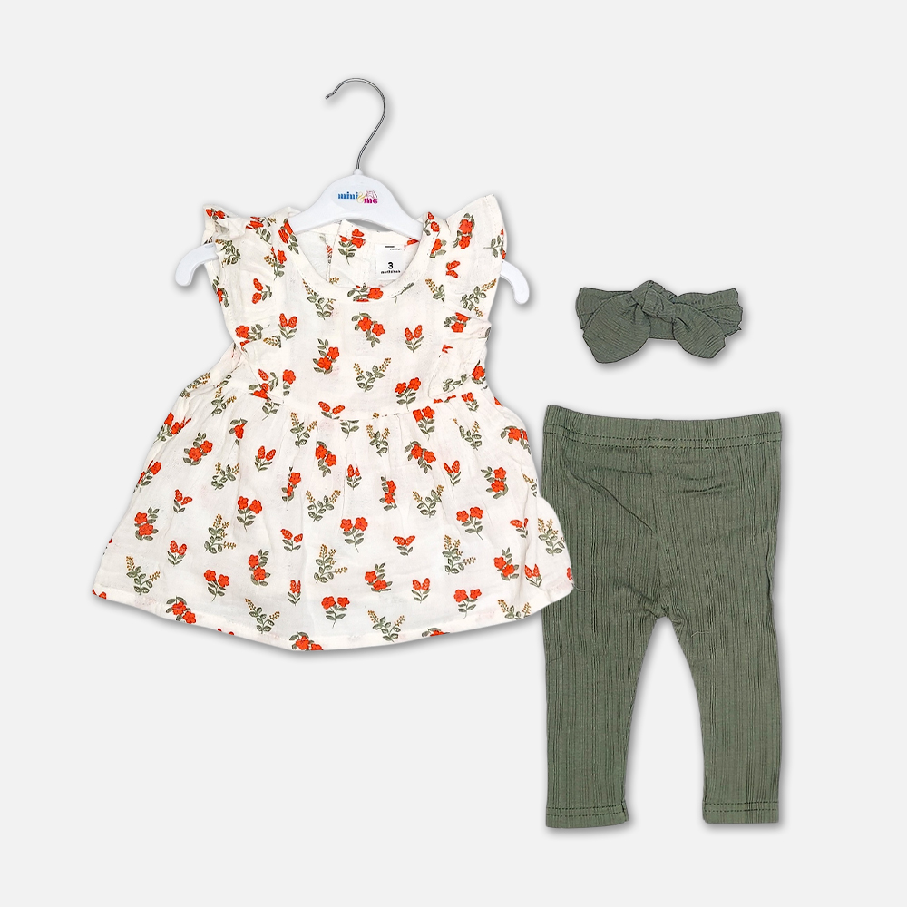 girlsSuit13122-1 A premium three-piece summer clothing set for baby girls featuring a sleeveless flared cream frock with an orange floral print and shoulder ruffles, paired with textured olive green ribbed leggings and a matching knotted bow headband, displayed on a white hanger.