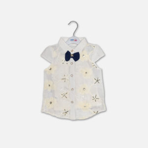 A premium two-piece baby girls clothing set featuring a white cap-sleeve button-down shirt with embroidered flowers, sequins, and a navy bow tie, alongside a pleated navy blue skirt with silver stripes and a metallic gold belt, displayed on a hanger.