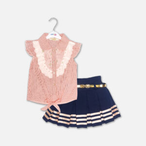 A premium two-piece summer outfit for baby girls featuring a peach and white pinstriped button-down blouse with an embroidered lace bib and tie-front knot, paired with a pleated navy blue skirt accented with metallic pink stripes and a gold belt, shown on a white hanger.