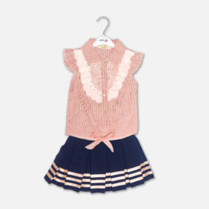 A premium two-piece summer outfit for baby girls featuring a peach and white pinstriped button-down blouse with an embroidered lace bib and tie-front knot, paired with a pleated navy blue skirt accented with metallic pink stripes and a gold belt, shown on a white hanger.